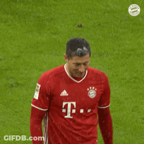 A Man Wearing A Red T-Mobile Jersey Stands On A Soccer Field GIF