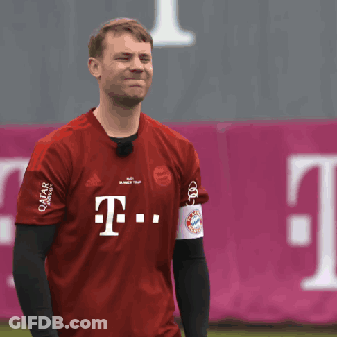 A Man Wearing A Red T-Mobile Shirt Makes A Face GIF