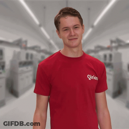 A Man Wearing A Red T-Shirt That Says ' Qirion ' On The Front GIF