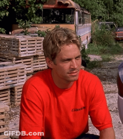 A Man Wearing A Red T-Shirt With The Word Greddy On It GIF