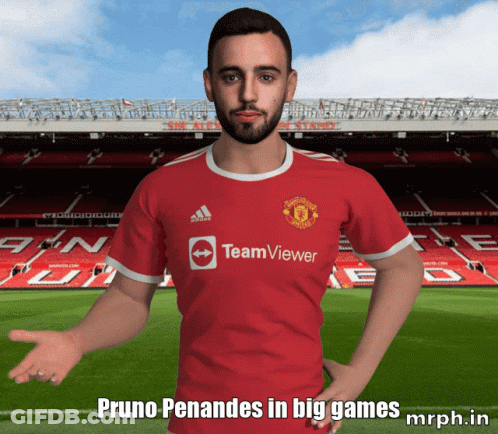 A Man Wearing A Red Teamviewer Jersey Stands In Front Of A Soccer Field GIF