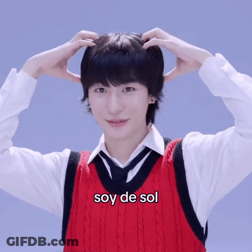 Man In Red Vest And Tie With Soy De Sol On Chest GIF