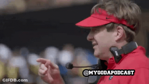 A Man Wearing A Red Visor And Headphones With The Words @Mygodapodcast Written Below Him GIF
