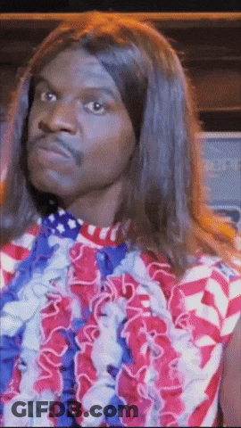 A Man Wearing A Red White And Blue Shirt And A Lei Around His Neck GIF