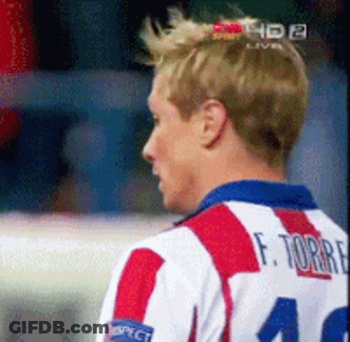 A Man Wearing A Red White And Blue Striped Shirt With The Number 40 On The Back GIF