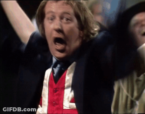 A Man Wearing A Red White And Blue Vest That Says L On It GIF
