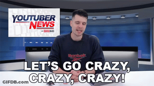 A Man Wearing A Reebok Shirt Is Sitting In Front Of A Youtuber News Sign GIF