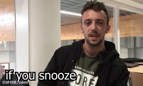 A Man Wearing A Reinforcedor T-Shirt Is Asking If You Snooze GIF