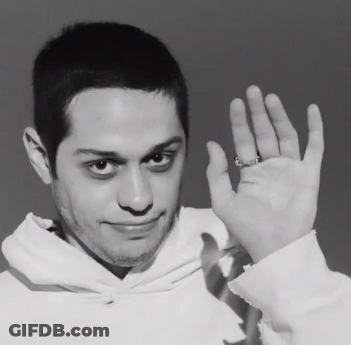 A Man Wearing A Ring On His Finger Is Waving His Hand GIF