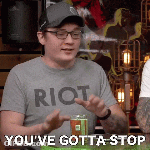 A Man Wearing A Riot Shirt Says You 'Ve Gotta Stop In Front Of A Can Of Soda GIF