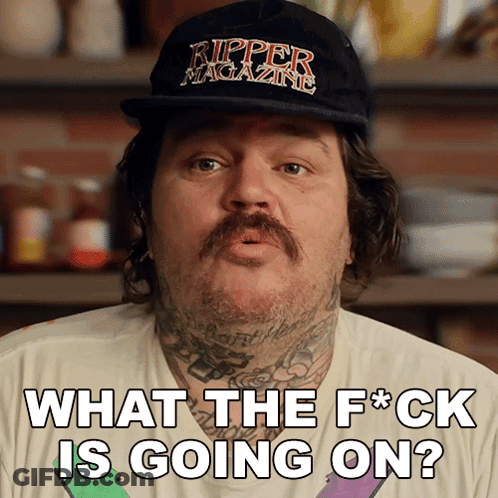 A Man Wearing A Ripper Magazine Hat Is Asking What The Fuck Is Going On GIF