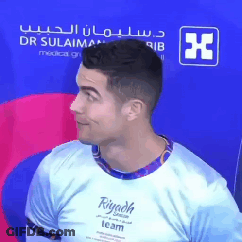 A Man Wearing A Riyadh Team Shirt Looks To The Side GIF