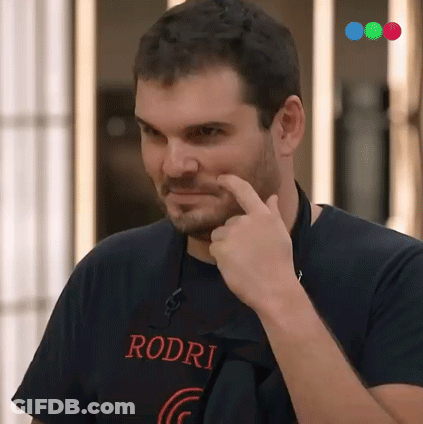 A Man Wearing A Rodri T-Shirt Is Pointing At His Face GIF