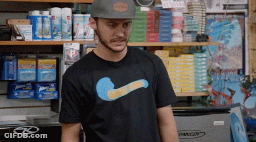 A Man Wearing A Rvca Hat And A T-Shirt With A Wave On It GIF
