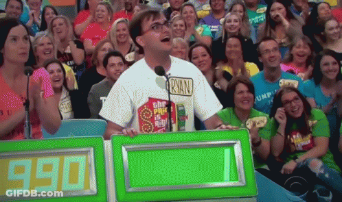 A Man Wearing A Ryan Shirt Stands In Front Of A Crowd GIF