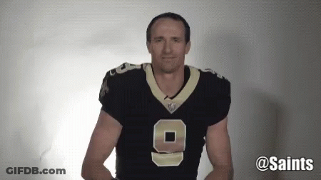 A Man Wearing A Saints Jersey With The Number 9 On It GIF
