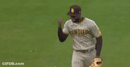 A Man Wearing A San Diego Jersey Is Running On The Field GIF