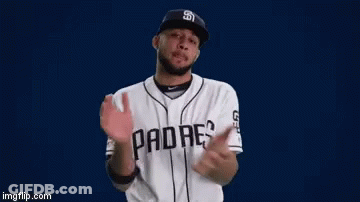 A Man Wearing A San Diego Padres Baseball Uniform Is Clapping His Hands GIF