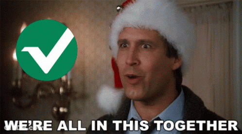 A Man Wearing A Santa Hat And A Check Mark Says We 'Re All In This Together GIF