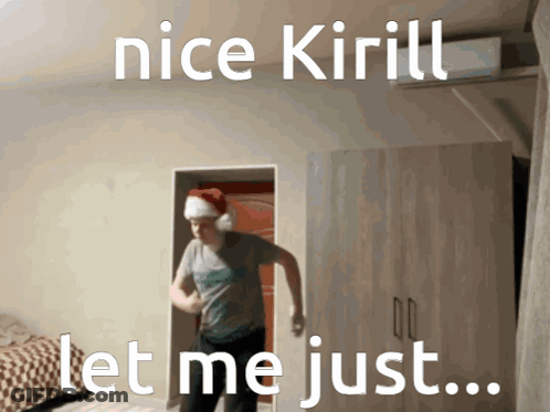 A Man Wearing A Santa Hat Is Dancing In A Room With The Words Nice Kirill Let Me Just GIF