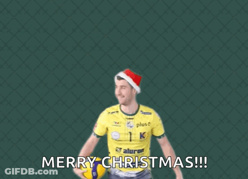 A Man Wearing A Santa Hat Is Jumping To Catch A Volleyball With The Words Merry Christmas Below Him GIF