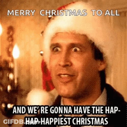 A Man Wearing A Santa Hat Is Saying Merry Christmas To All . GIF