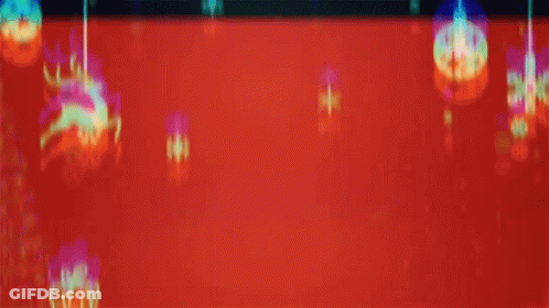 A Man Wearing A Santa Hat Is Surrounded By Christmas Decorations On A Red Background GIF