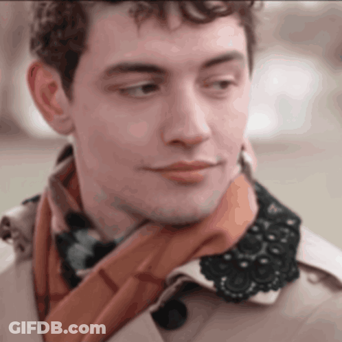 A Man Wearing A Scarf And A Trench Coat With A Lace Collar GIF