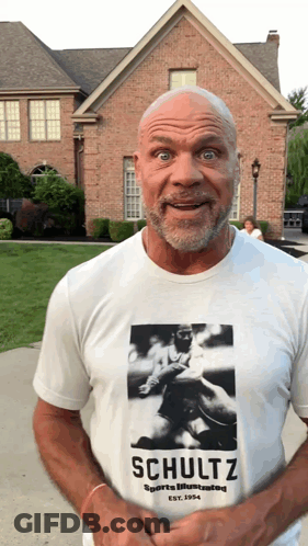 A Man Wearing A Schultz Sports Illustrated T-Shirt GIF