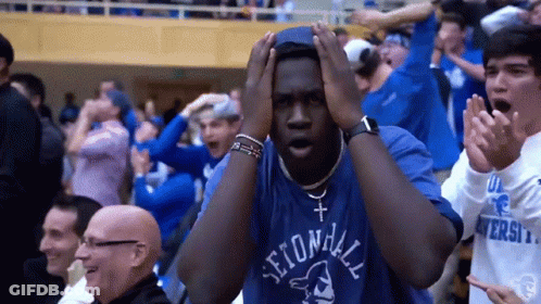 A Man Wearing A Second Hill Shirt Holds His Hands To His Head GIF