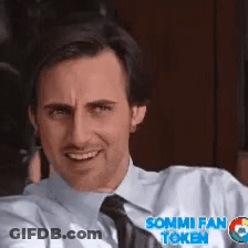 A Man Wearing A Shirt And Tie With Sommi Fan Token On His Shirt GIF