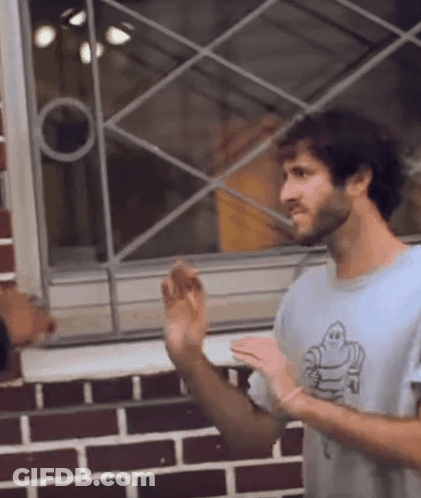 A Man Wearing A Shirt That Has A Ghost On It GIF