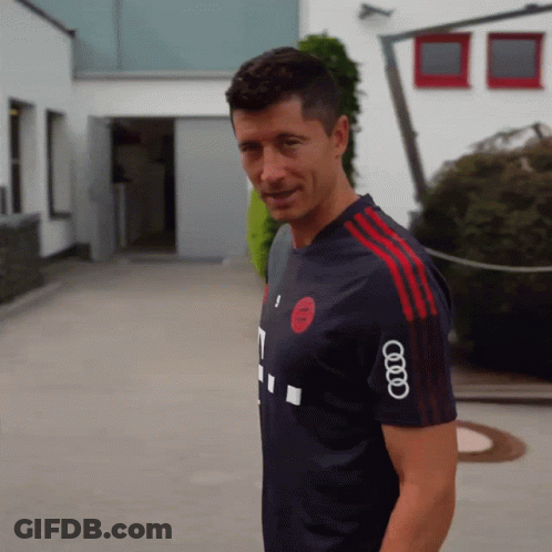 A Man Wearing A Shirt That Has The Word Audi On The Sleeve GIF