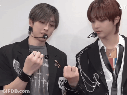 A Man Wearing A Shirt That Says ' Absolute ' On It Is Standing Next To Another Man GIF