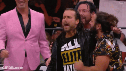 A Man Wearing A Shirt That Says All Elite Rays Is Surrounded By Other Men GIF