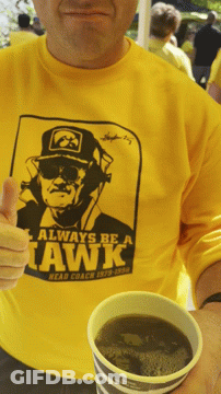 A Man Wearing A Shirt That Says Always Be A Hawk GIF