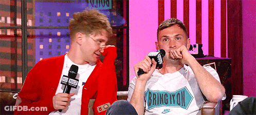 A Man Wearing A Shirt That Says Bring It On GIF