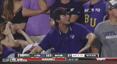 A Man Wearing A Shirt That Says ' Bu ' On It GIF