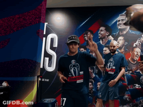 A Man Wearing A Shirt That Says ' Champions ' On It GIF