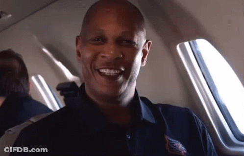 A Man Wearing A Shirt That Says ' Chicago ' On It GIF