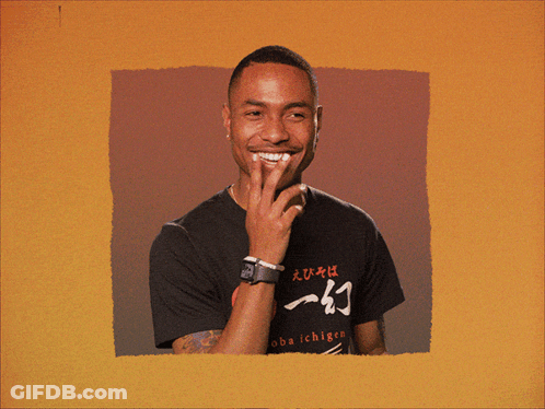 A Man Wearing A Shirt That Says Chigen On It Smiles GIF