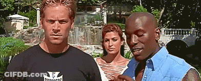 A Man Wearing A Shirt That Says ' Diamond ' On It Stands Next To Two Other Men GIF
