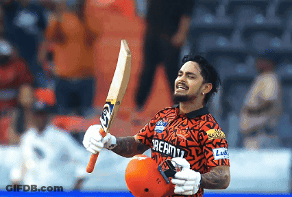 A Man Wearing A Shirt That Says Dream11 Holds Up A Bat GIF