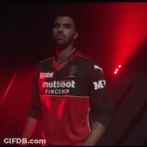 A Man Wearing A Shirt That Says Exide Muhoot Fincorp GIF