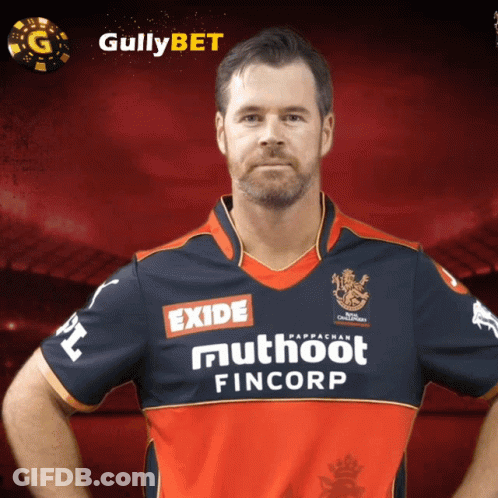 A Man Wearing A Shirt That Says Exide Muthooth Fincorp GIF
