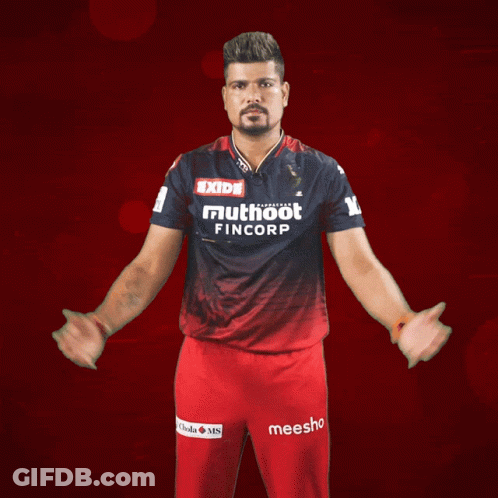 A Man Wearing A Shirt That Says Exide Mutuoot Fincorp GIF
