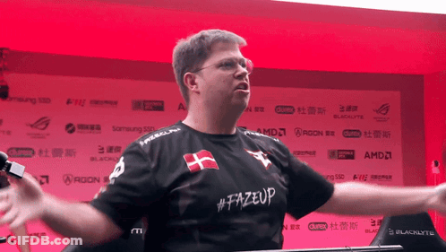 A Man Wearing A Shirt That Says # Fazeup GIF