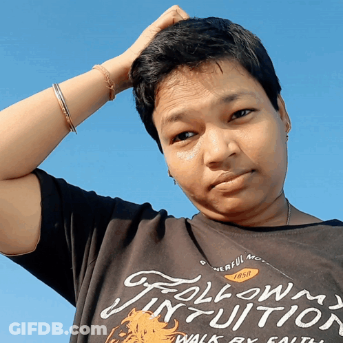 A Man Wearing A Shirt That Says Follow Your Intuition GIF