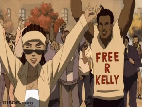 A Man Wearing A Shirt That Says " Free R Kelly " GIF