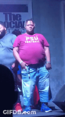 A Man Wearing A Shirt That Says Fsu Football GIF